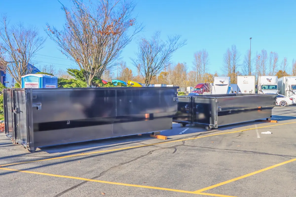 Professional dumpster rental service with roll-off container on residential driveway in Nocatee